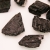Niepolerowana bryłka czarnego turmalinu - autentyczny surowy minerał.