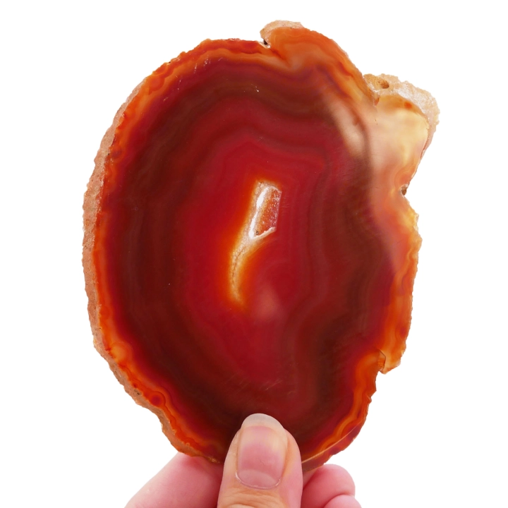 Pomarańczowy plaster agatu nr 076 – widok na wypolerowaną powierzchnię z wyraźnym układem koncentrycznych pasm.